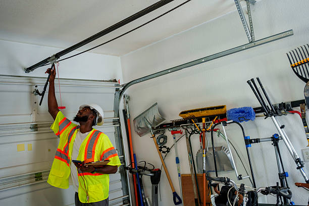 Professional Garage Door Panel Replacement technician working in College, AK